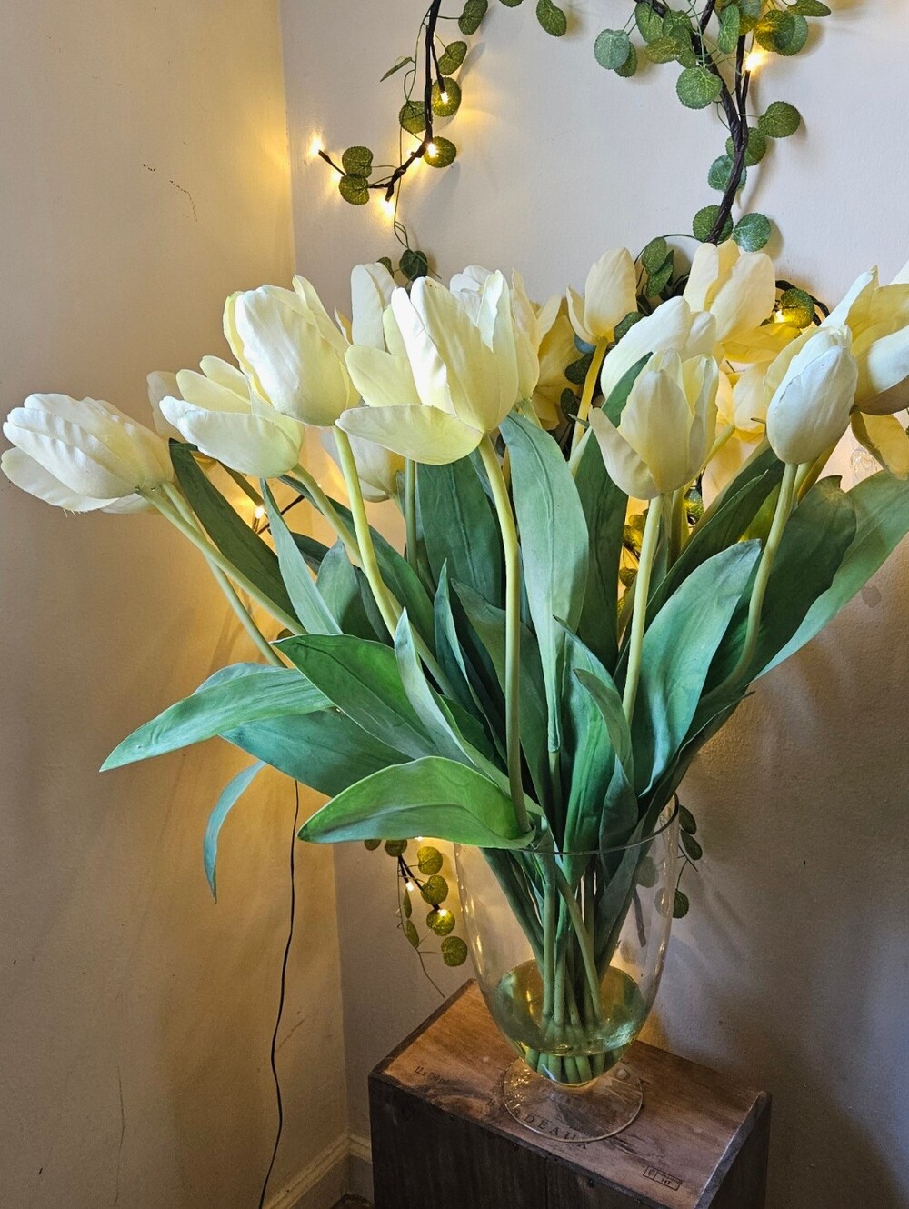 22 large bouquet of artificial cream-yellow tulips arranged inside a clear glass